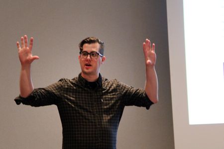 Me speaking at a conference but my arms are raised at 90 degree angles like I'm doing the chicken dance.